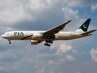 LONDON / UNITED KINGDOM - JULY 14, 2018: PIA Pakistan International Airlines Boeing 777-200 AP-BGL passenger plane landing at London Heathrow Airport